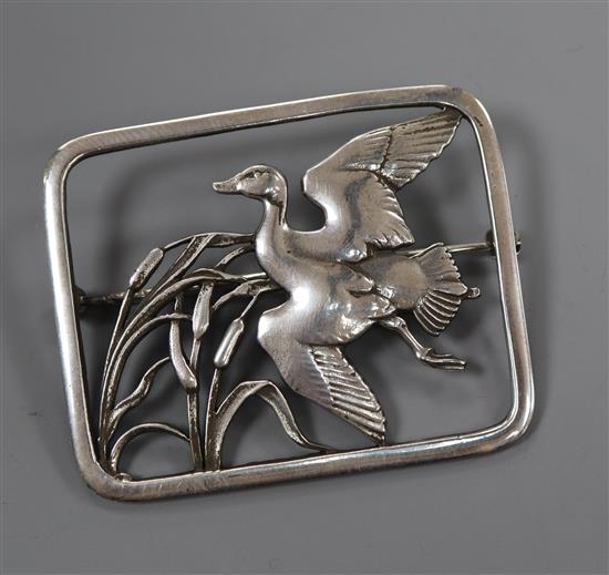 A Georg Jensen sterling duck in flight amongst reeds rectangular brooch, no. 300, 48mm.